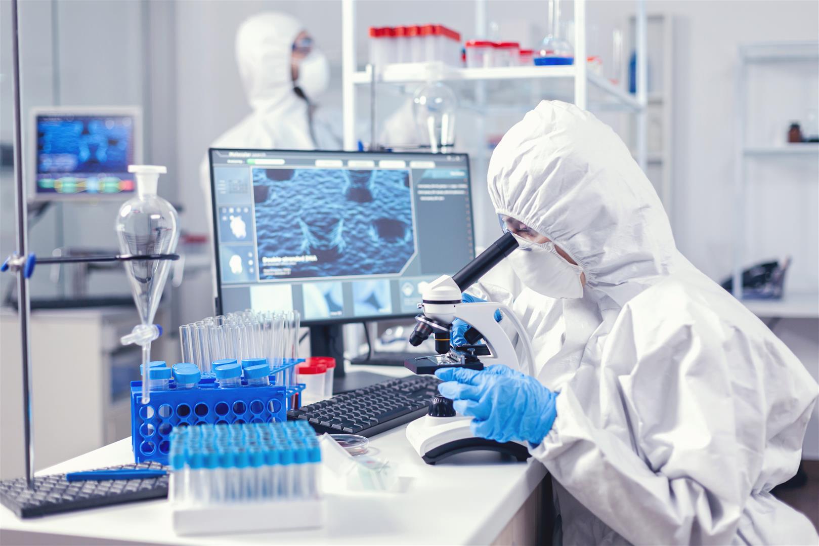 team-medical-personal-wearing-ppe-suit-doing-coronavirus-analysis-modern-laboratory-chemist-researcher-during-global-pandemic-with-covid-19-checking-sample-biochemistry-lab.jpg