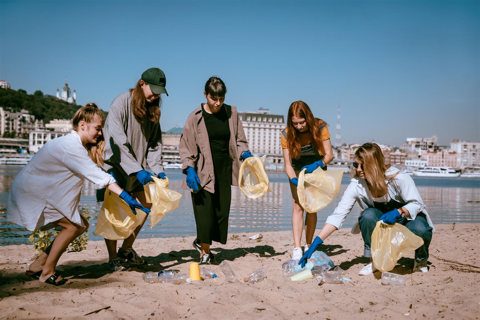 group-activists-friends-collecting-plastic-waste-beach-environmental-conservation (1).jpg