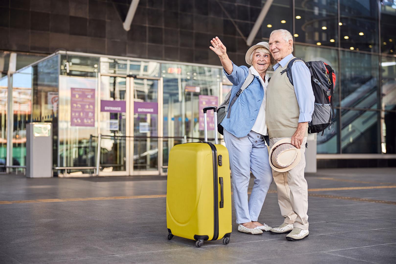 full-length-portrait-attractive-smiling-merry-lady-pointing-something-aged-man.jpg