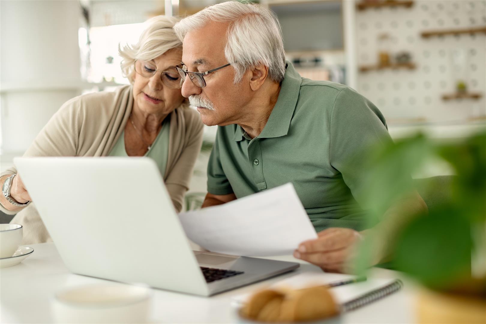 senior-couple-analyzing-their-savings-while-going-through-home-finances.jpg