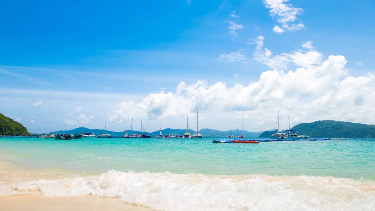 Adventure Tourism: White Sand Beach, Coral Reef, School of Fish, and Diving at Coral Island in Phuket
